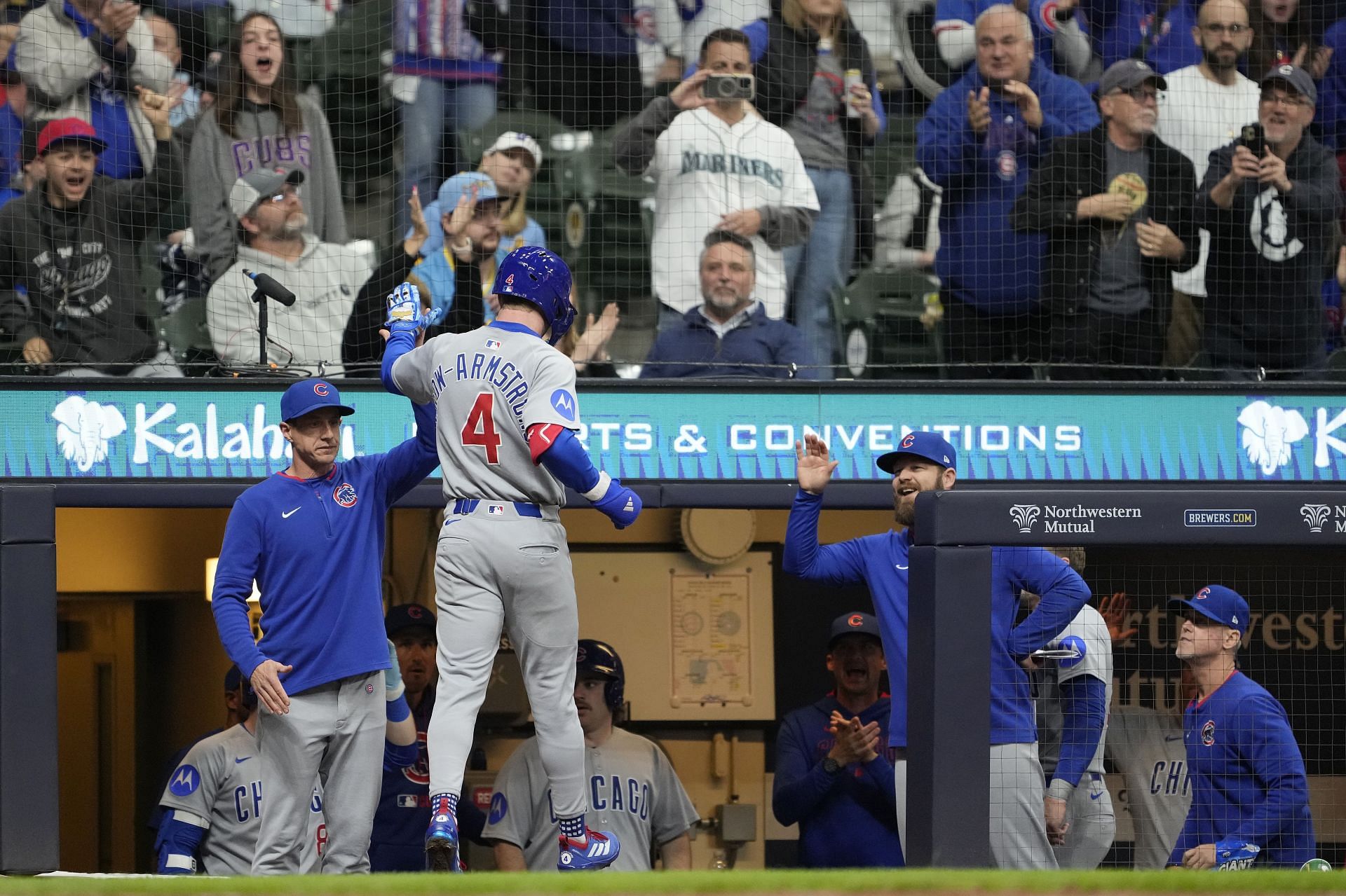 Pete Crow-Armstrong high-fives his skipper, Craig Counsell, in the Chicago Cubs dugout - Source: Getty